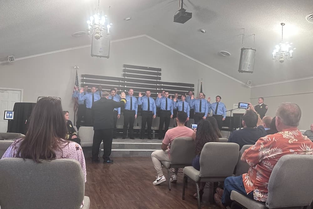 Fire Chief Jeff Hevey swears in 17 new firefighters