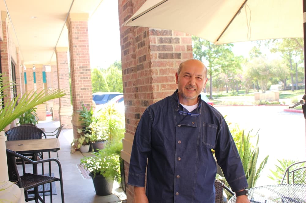 Owner of Delices de Maurice and Pastry Chef Dany Srour poses in front of his bakery. 