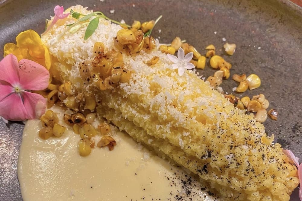 Tamale de elote presentation as corn on the cob