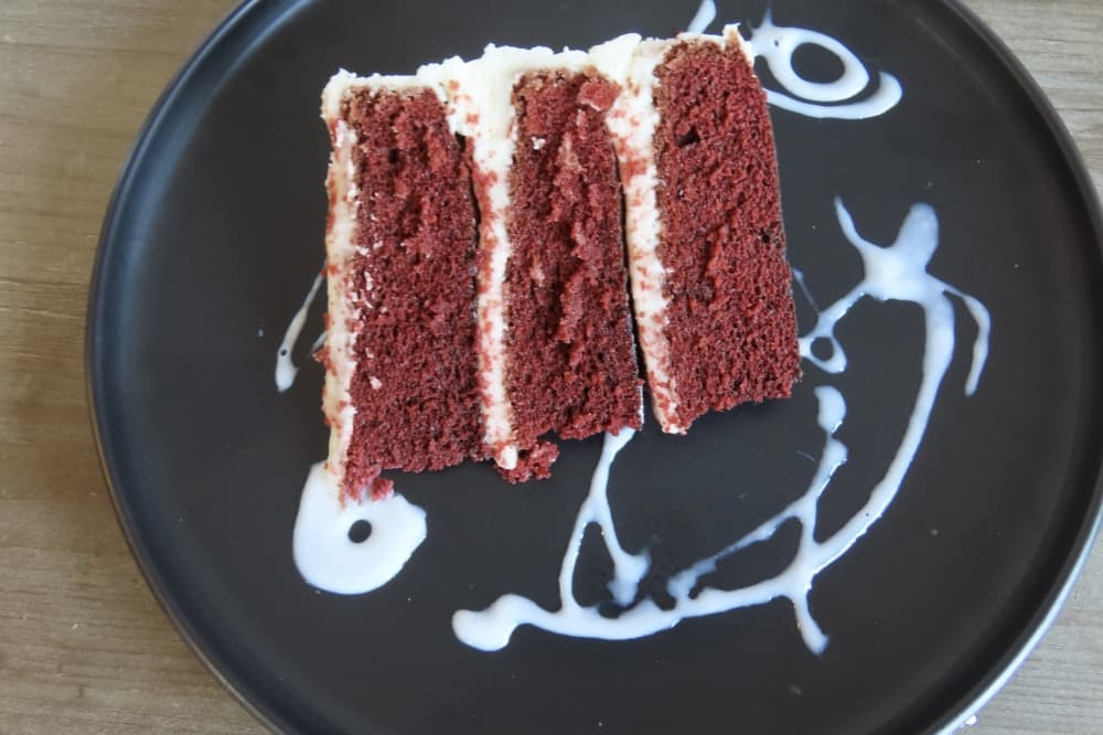 Serving of red velvet cake at Tell Me Something Sweet Bakery and Cafe in Plano. 