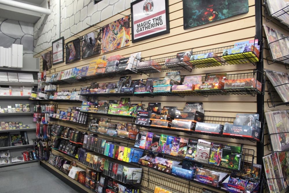 Shelving with collectible card games. 