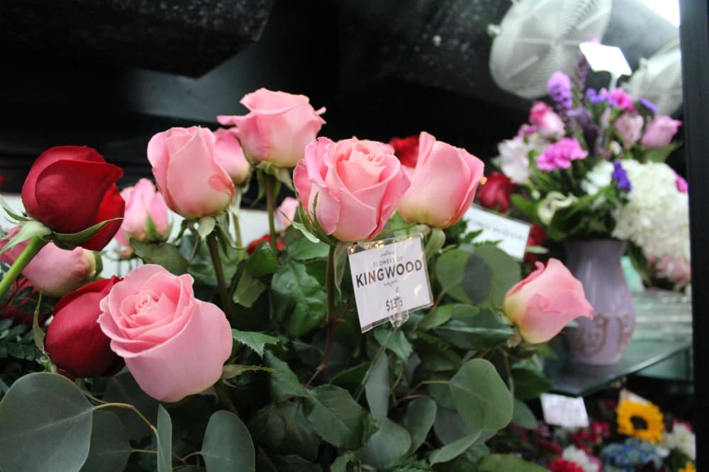The photo shows a bouquet of fresh pink roses.