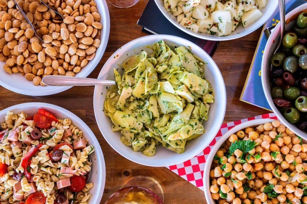 A table is filled with Italian food.