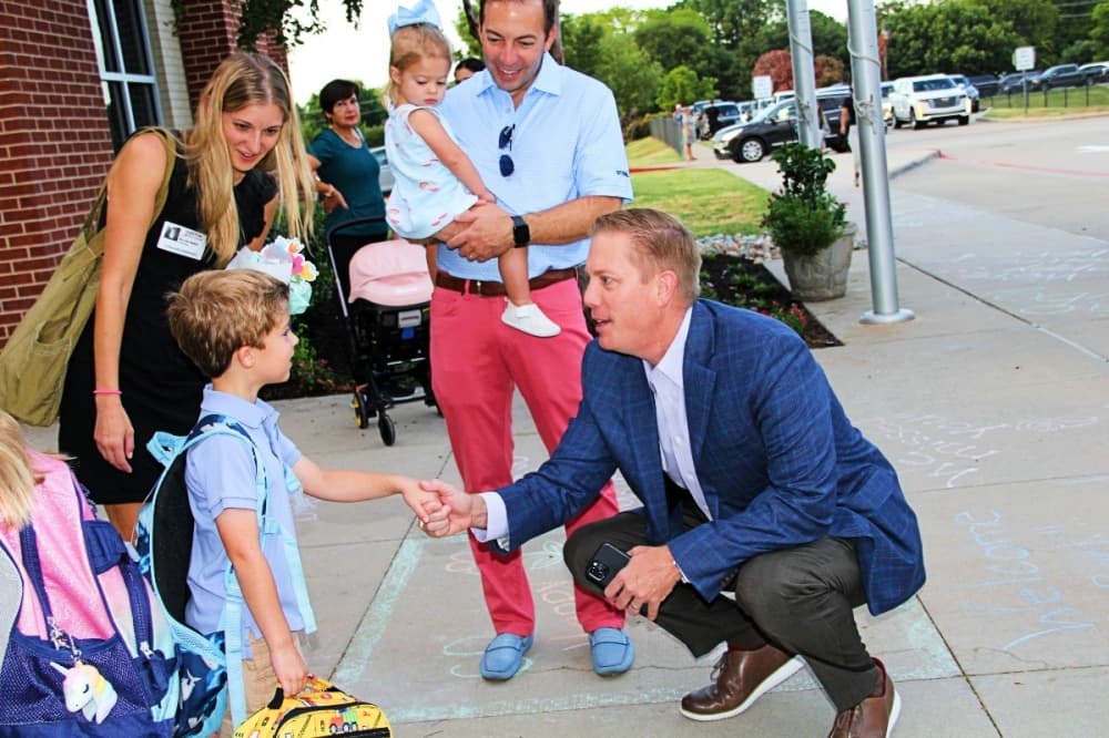 superintendent interacting with students