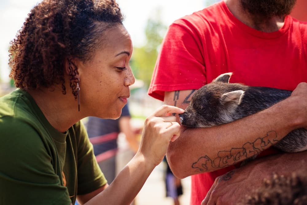 Woman with a small pig