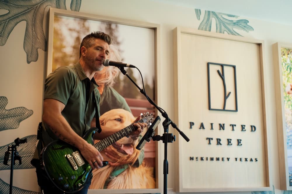 Man performing with a guitar