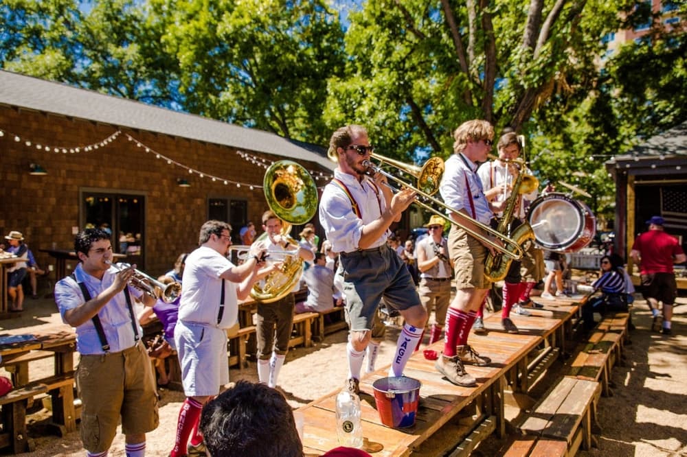 A German-style band plays outside at a previous Oktoberfest party.