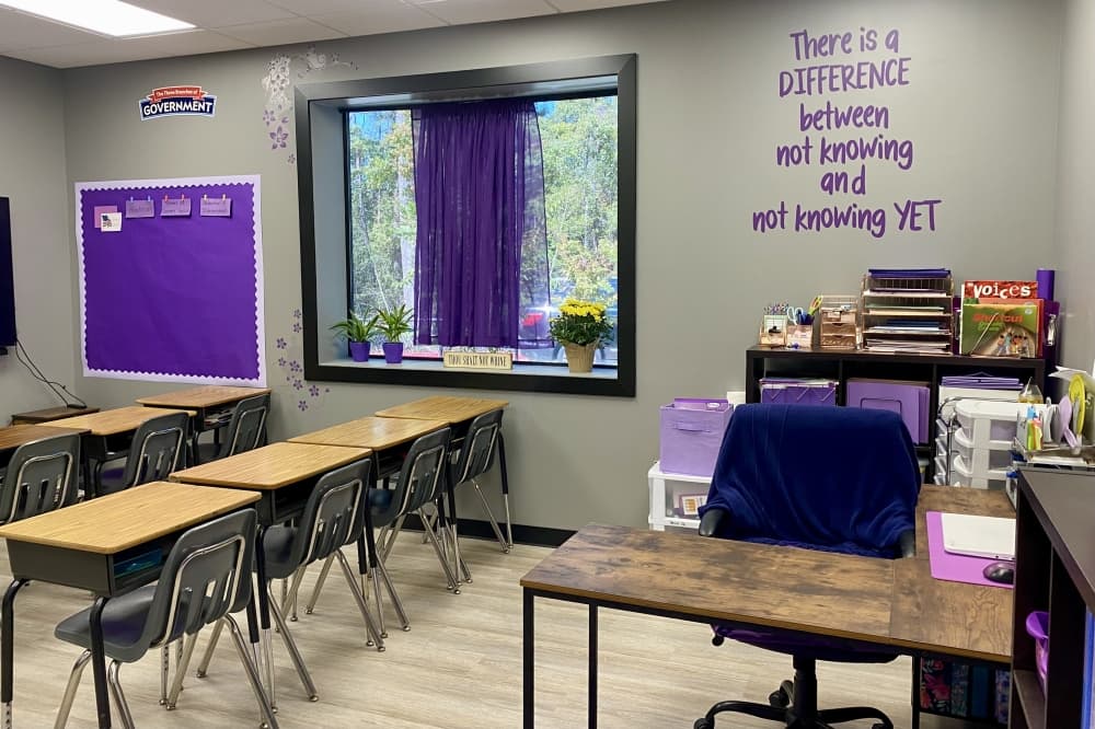 A classroom with desks and chairs