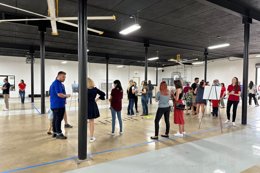 People stand in the Lifesaving Partnerships Hub's interior.