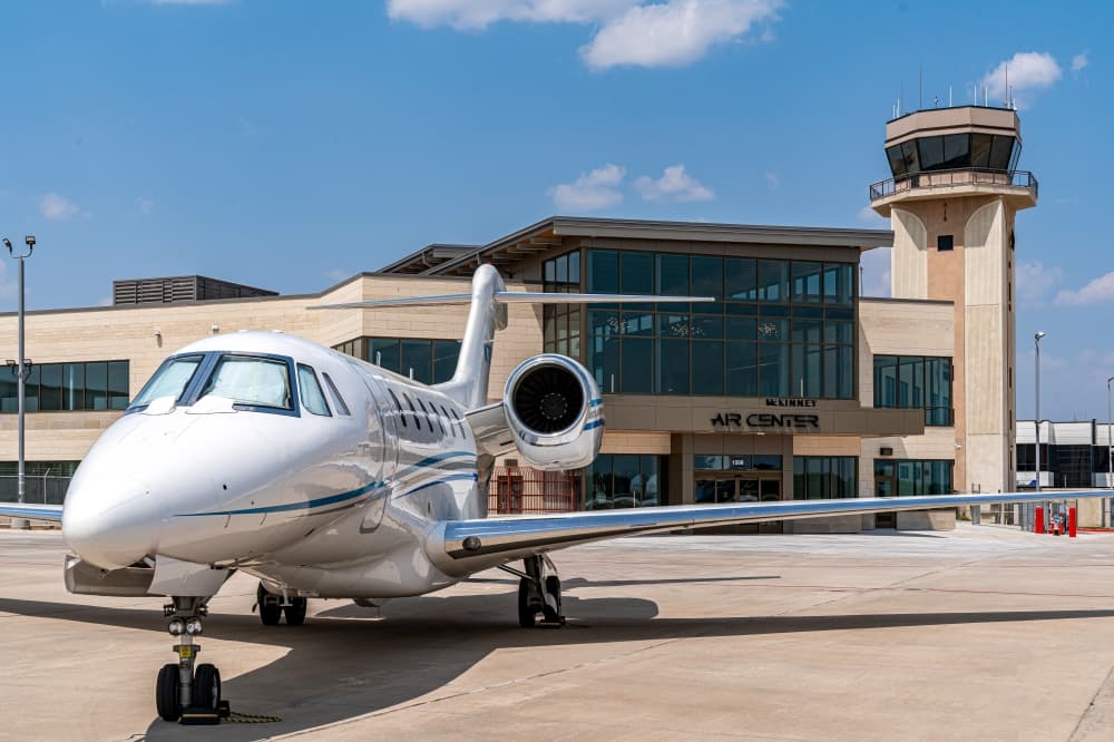 A plane in front of McKinney Air Center