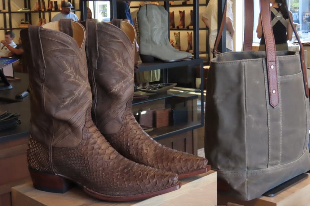Boots and a satchel are on display at Tecovas in Southlake. 