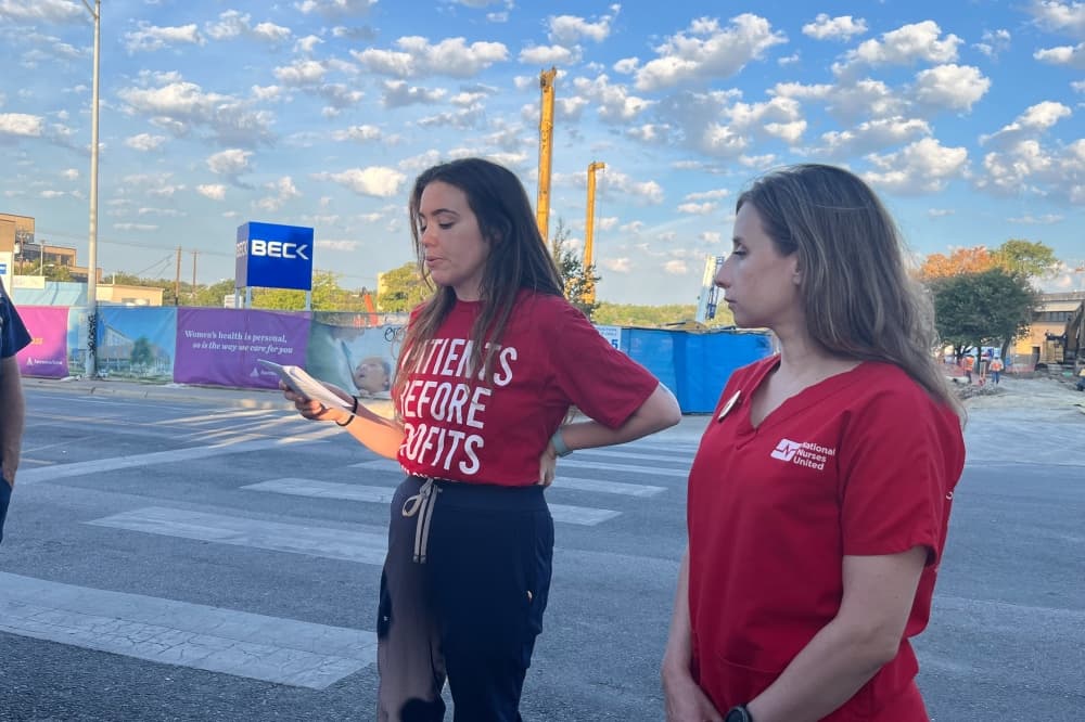 Two nurses speak at rally at under-construction medical center