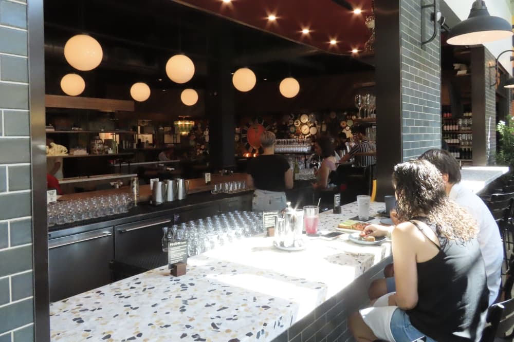 Couple sits at bar at Postino WineCafe in Southlake. 