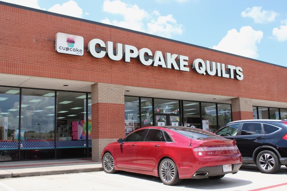 The photo shows the exterior of Cupcake Quilts' Humble location.