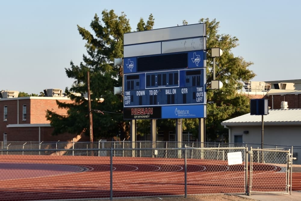 a blue stadium scoreboard