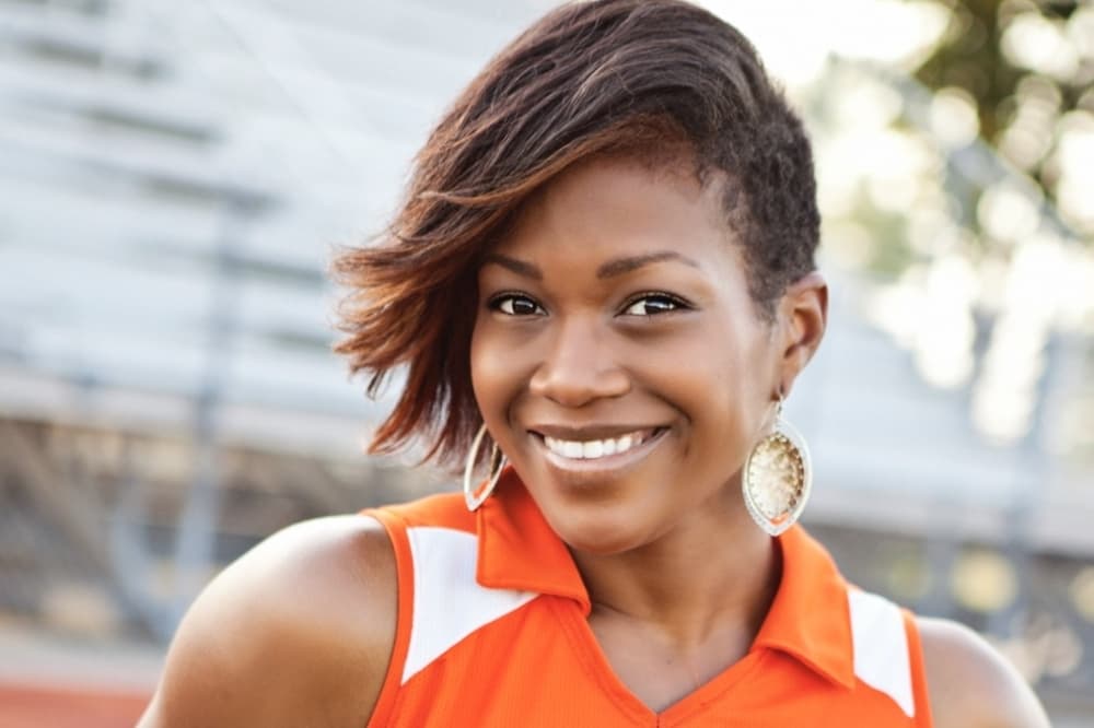 Ashely Goncalves with Sideline orange shirt