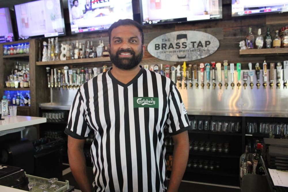 Brass Tap co-owner Ridham Bhatt behind the bar. 