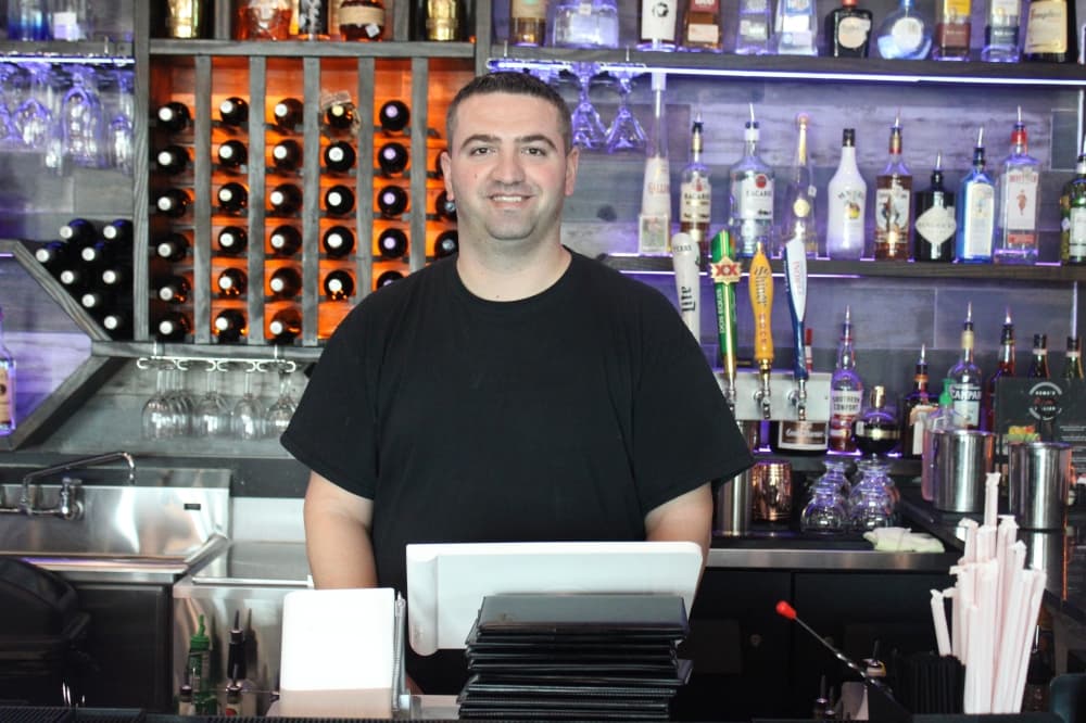 General manager Agon Zogaj behind the bar