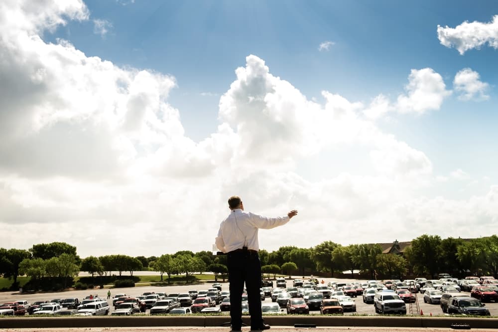 Pastor gives outdoor sermon during the COVID-19 pandemic in Lewisville. 