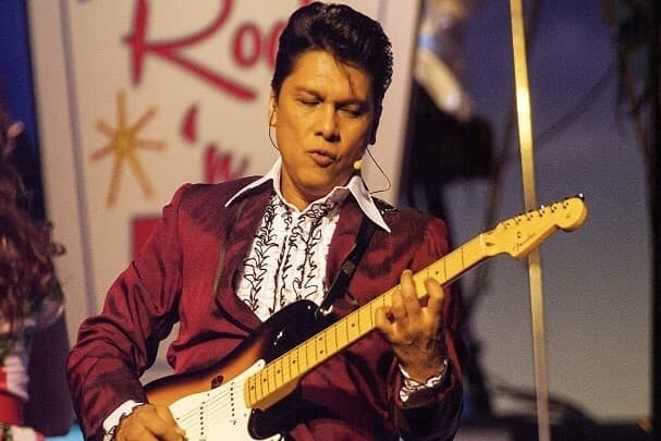 Sting Ray Anthony performing with guitar 