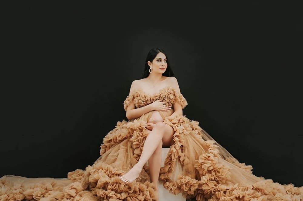 Kanis Photography model wearing luxury cream light brown gown