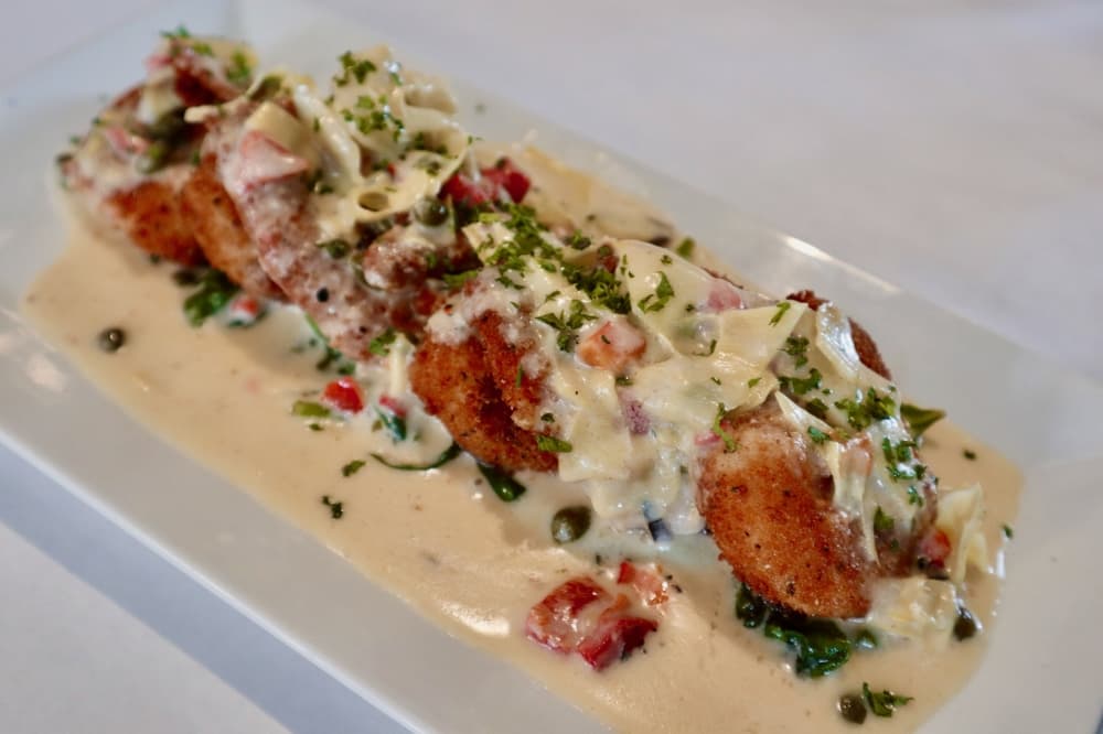 Breaded shrimp in caper-artichoke cream sauce