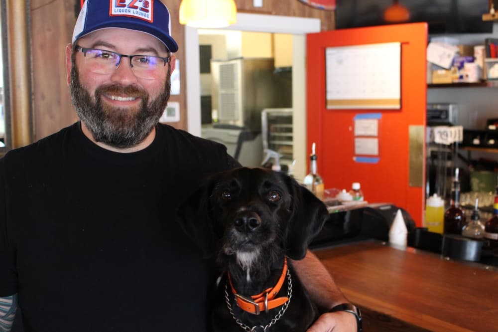 Matthew Tanner, the bar's owner and Greta, the bar dog. 