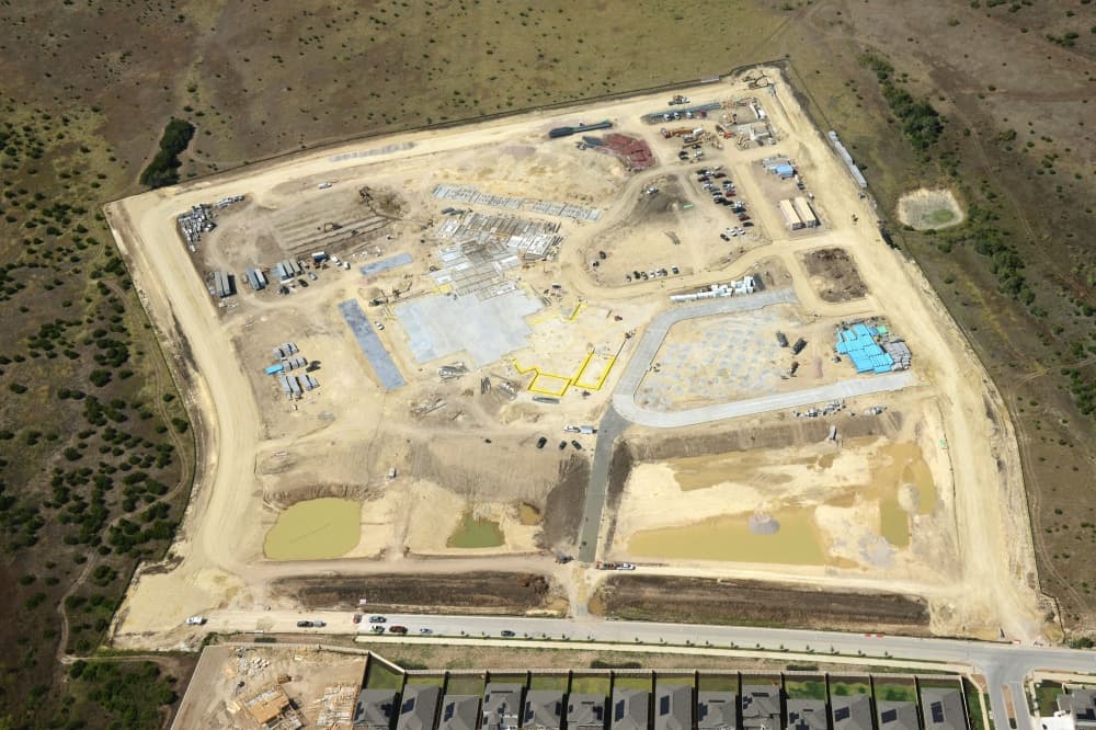 An aerial view of Elementary School No. 30 shows the campus in the beginning stages of construction
