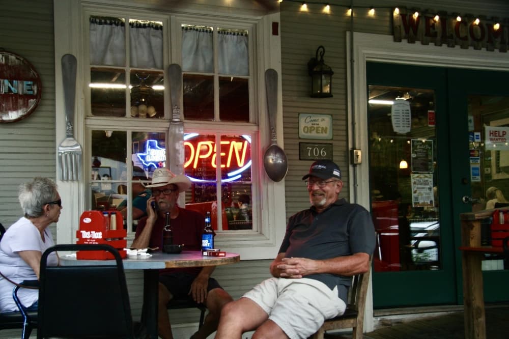 Older adults sitting at a table.