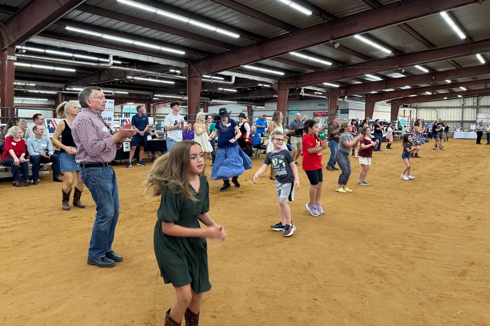 Adults and children dancing