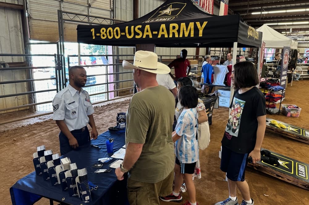 People talking to a military recruiter
