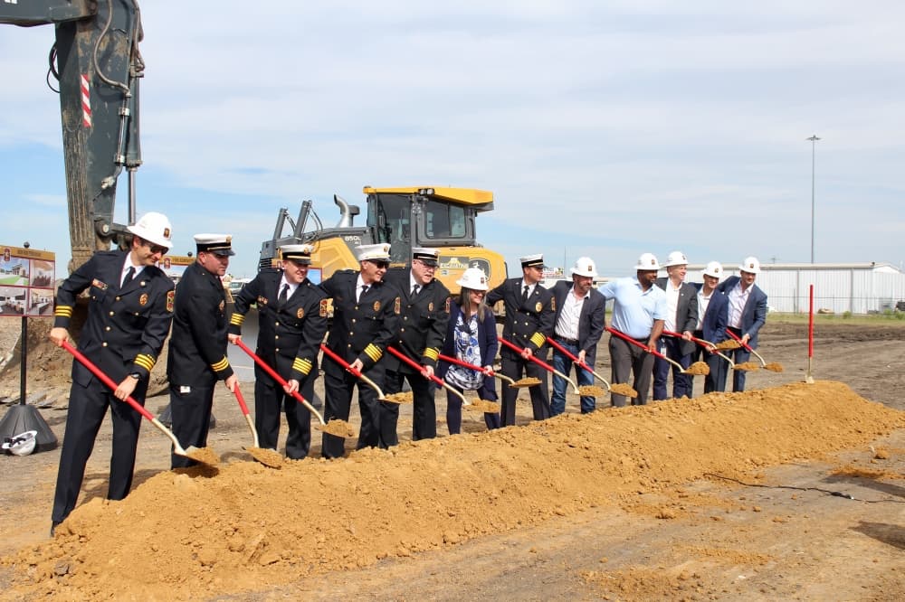 McKinney Fire Department officials and McKinney City Council members with shovels and dirt