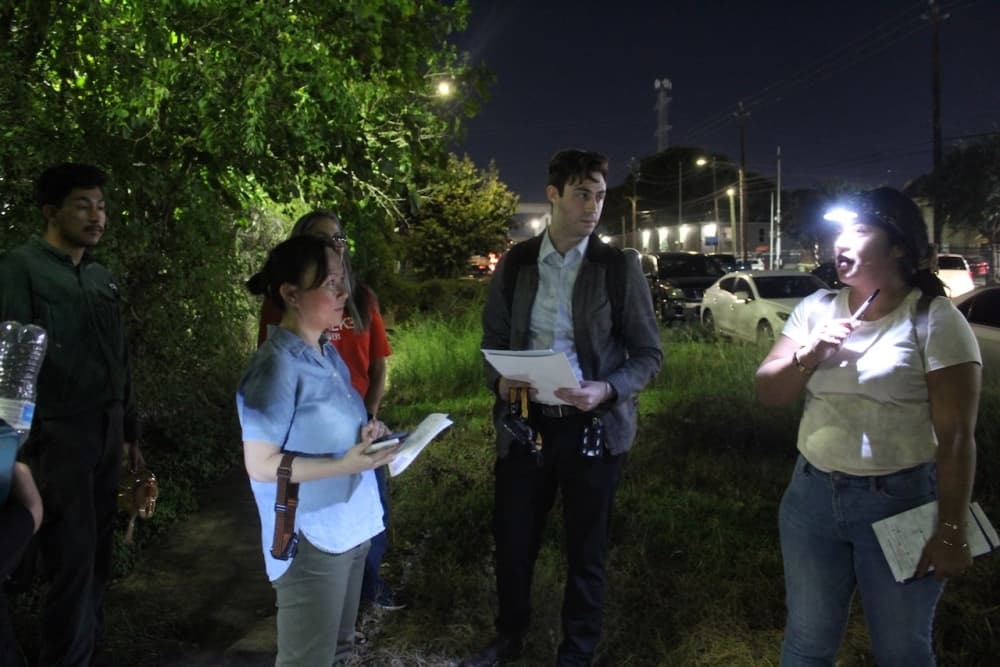 This is a picture of people using lighting in the night.
