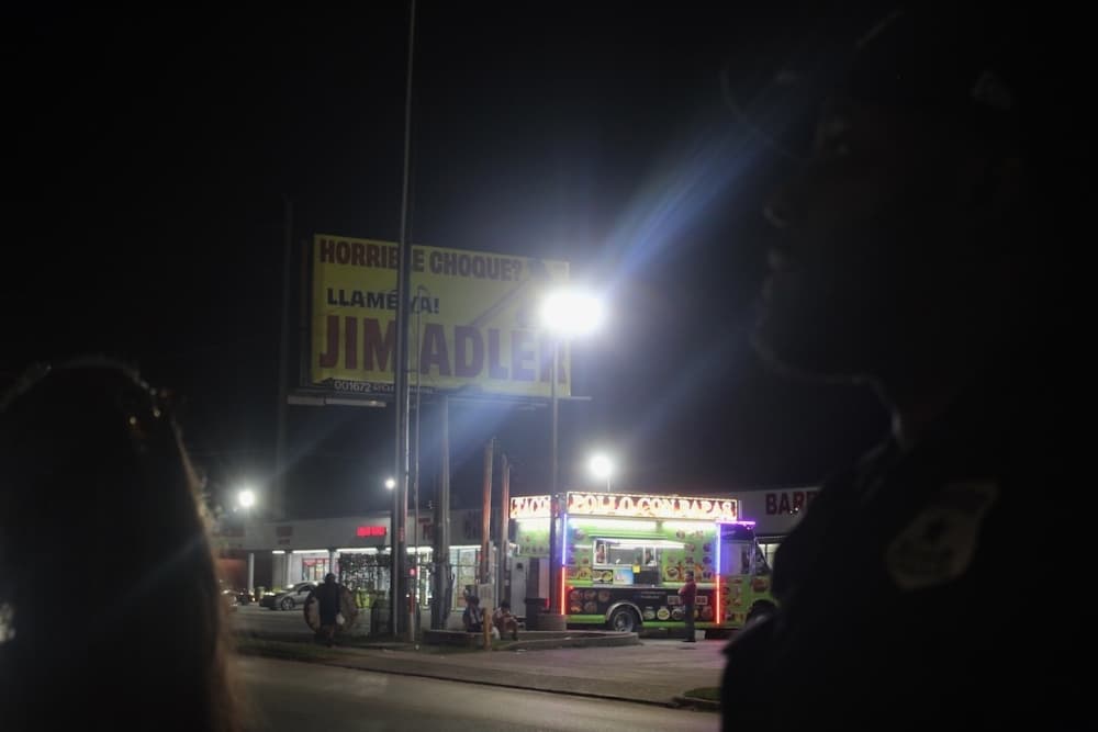 This is a billboard sign at night.
