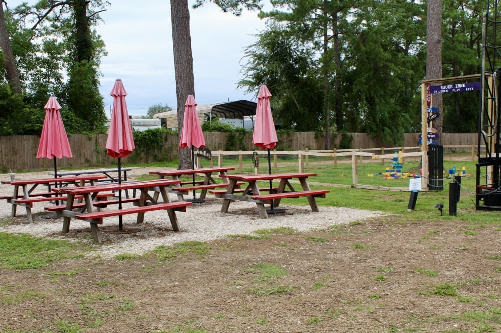 Outside picnic tables with umbrellas 