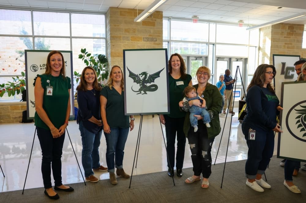 Administrators of NBISD posing with the logo