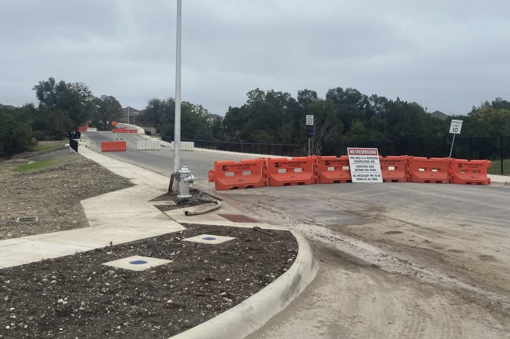 A street under construction is barricaded