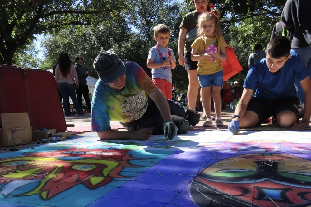 Artists draw with chalk at Plano International Festival 