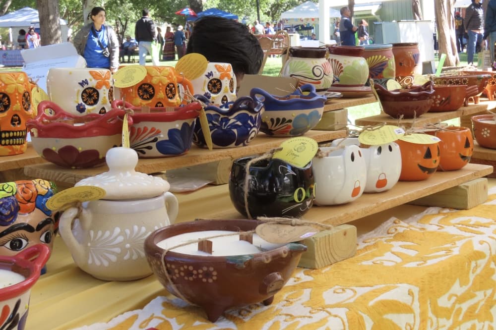 Pottery sits at booth at Plano International Festival