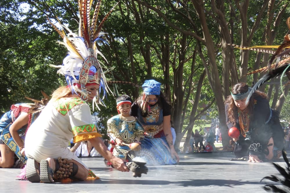 Dancer holds incense as part of the routine at Plano International Festival. 