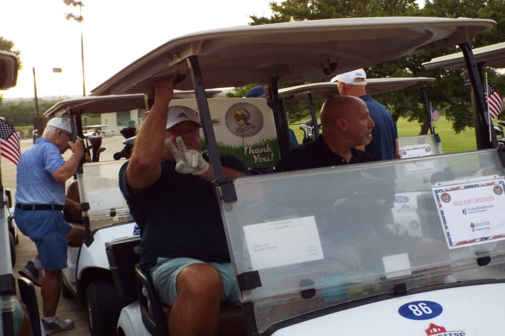 people riding in golf carts