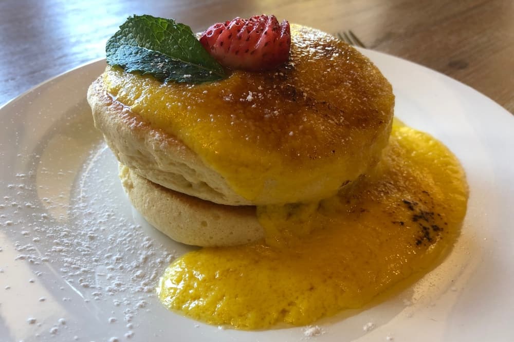 Baked good with filling and fruit on top