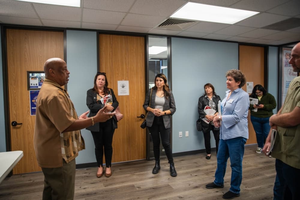people stand in a room