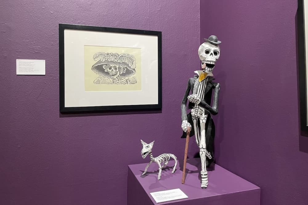a painting and two figurines 