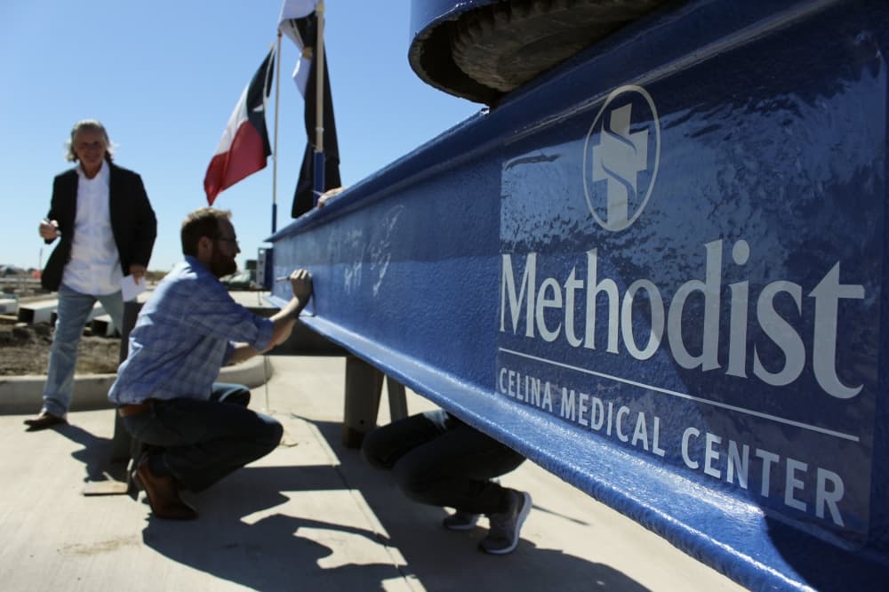 person signing methodist beam