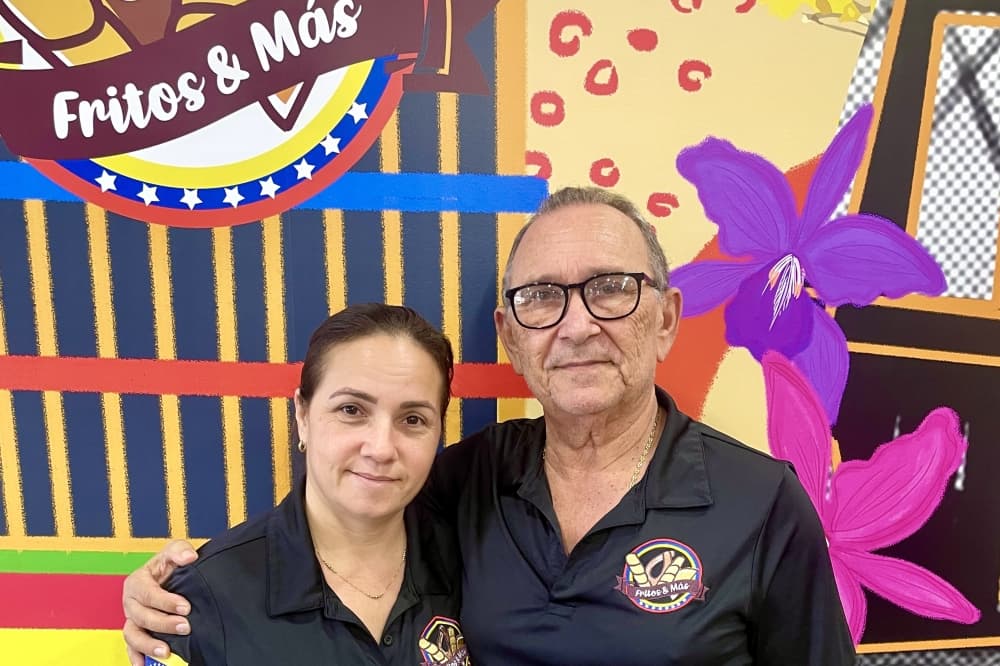 a man and woman pose for a photo