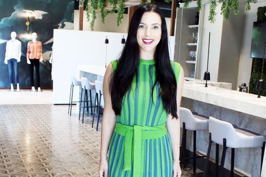 Kelsey Cameron wearing a green and blue Missook dress featuring detailed vertical knitting