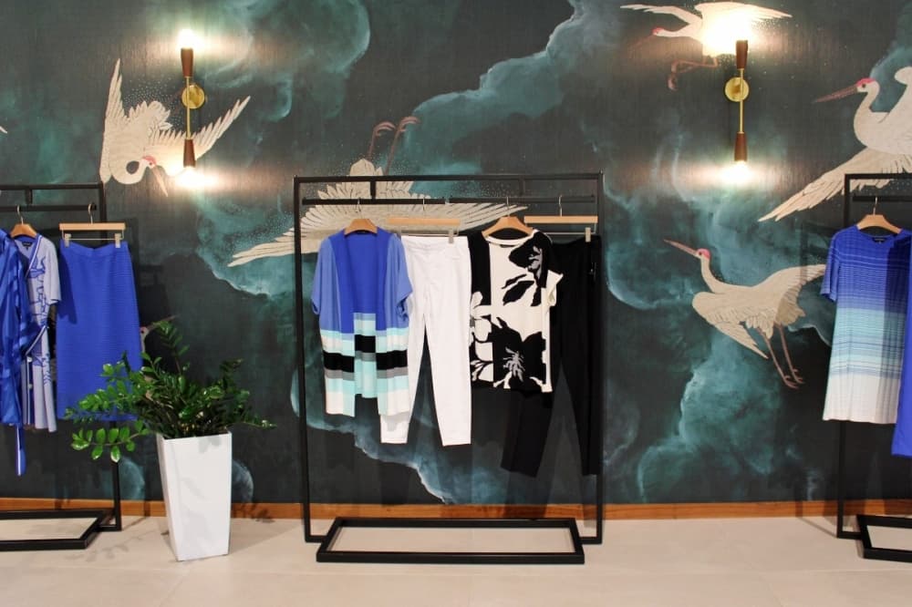 clothing on racks inside meison studio