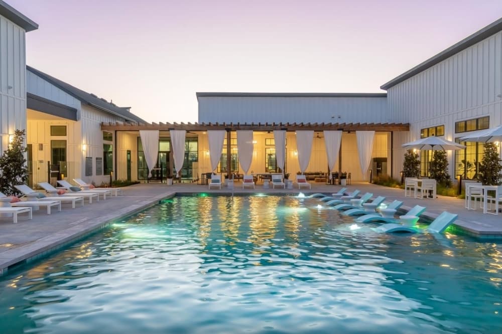 The amenities include a pool, dog park, playground, community center, fitness center, package lockers and a resident lounge with an arcade. (Courtesy Citizen House Wolf Ranch)