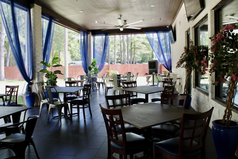 Patio with blue curtains 